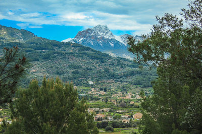 Scenic view of landscape and mountains against sky