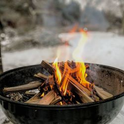 Close-up of bonfire on wooden log