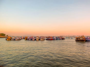 Scenic view of sea against clear sky during sunset