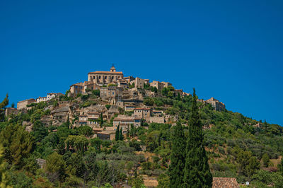View of gordes village on top of a hill, in the french provence.