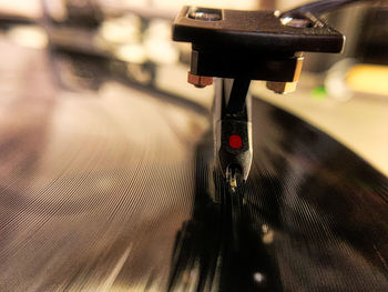 Close-up of machine part with coffee