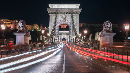 Light trails on road in city at night