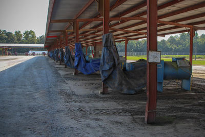 Agricultural machinery under shed at farm