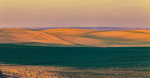 Scenic view of landscape against sky during sunset