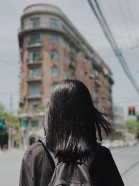 Rear view of woman in city