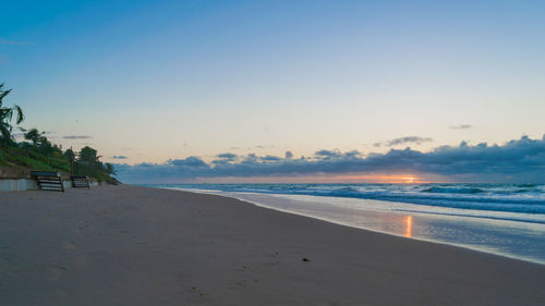 Scenic view of beach against sky during sunset