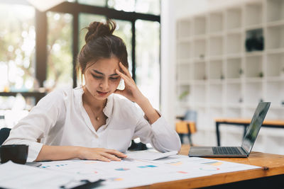 Businesswoman working at office