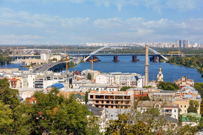 A view of the old podil district of summer kyiv, automobile and railway bridges,