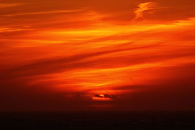 Scenic view of sea against orange sky