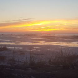 Scenic view of sunset over sea