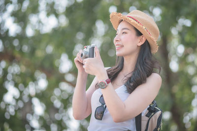 Young woman using mobile phone outdoors