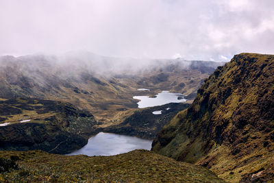 Scenic view of landscape and mountains against sky