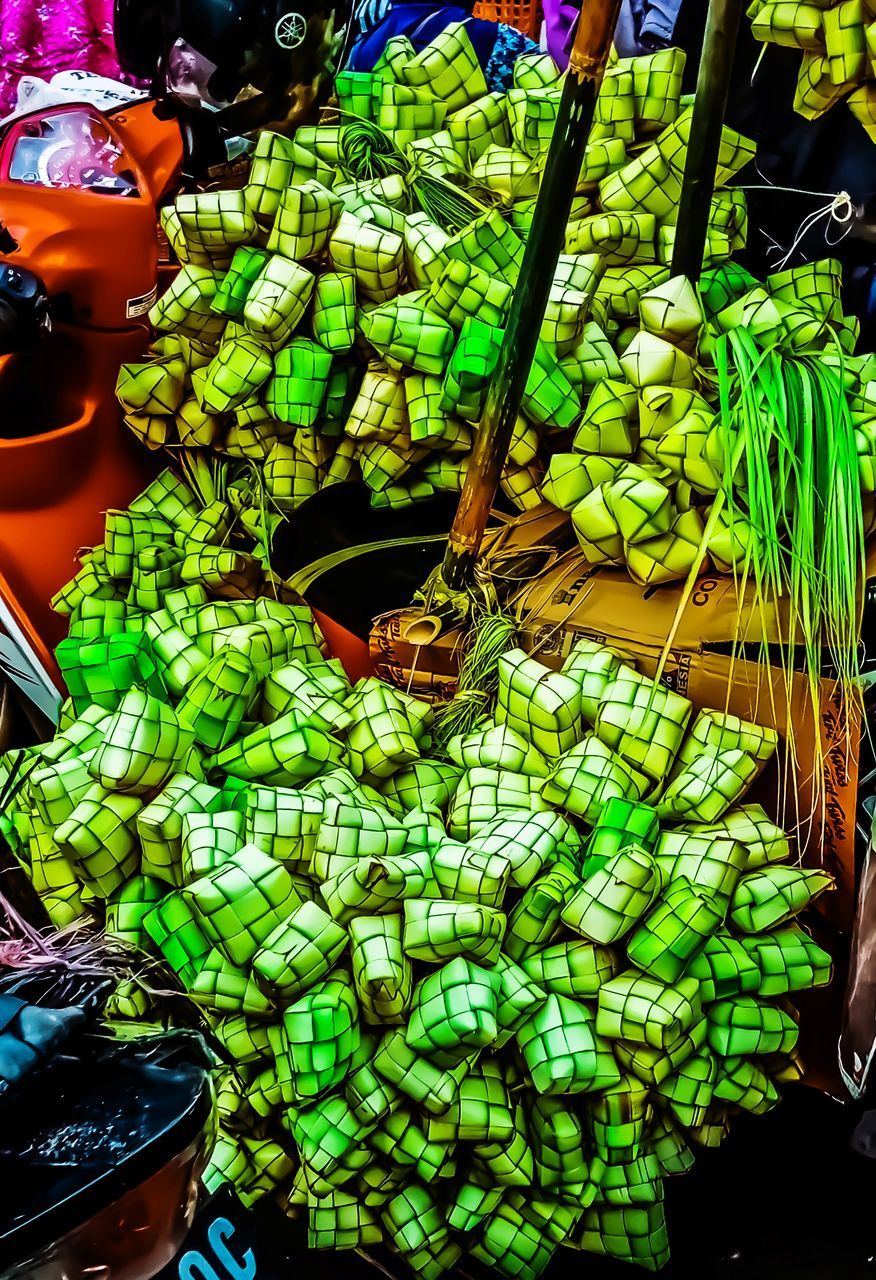 CLOSE-UP OF GREEN FOR SALE IN MARKET