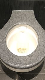 High angle view of illuminated tea light on table