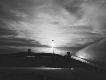 Airplane flying over cloudy sky