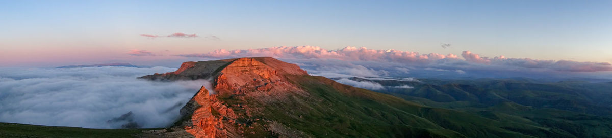 High angle view of rock formations against sky during sunset