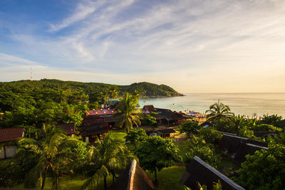 Scenic view of sea and buildings against sky