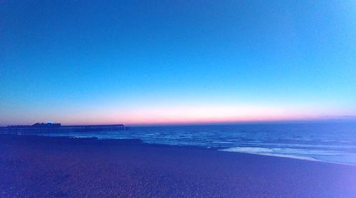 Scenic view of sea against clear blue sky