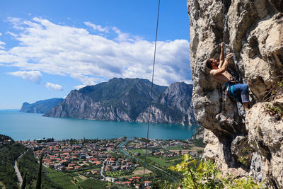 Rock climbing with garda lake view