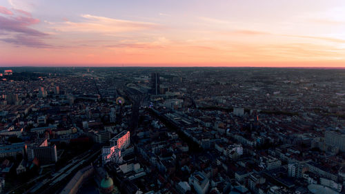 High angle view of city against sky during sunset