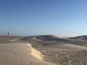 Scenic view of desert against clear sky