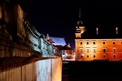 Illuminated buildings in city at night