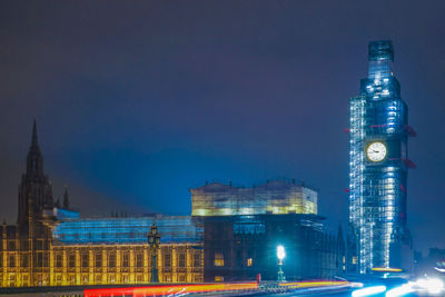 Illuminated buildings in city at night