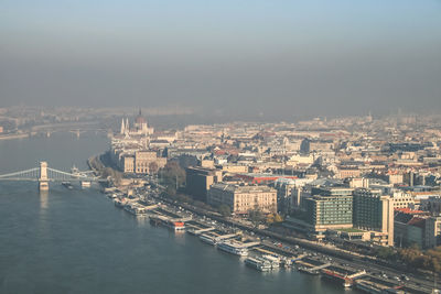 High angle view of river and buildings in city 