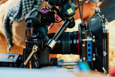 Cinema camera on film set, behind the scenes background, film crew production