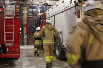 Firefighters walking into fire engine