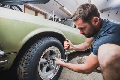 Man changing car tire