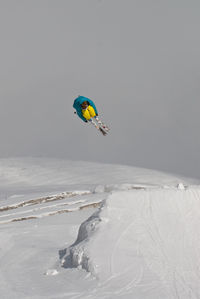 Person paragliding in snow