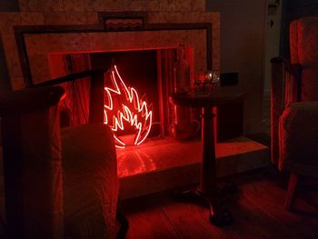 Red light painting on wooden floor at home