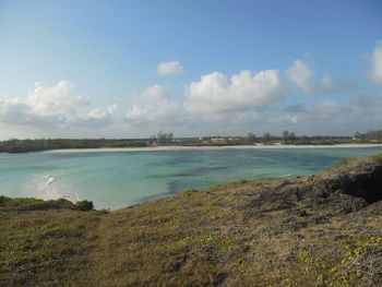 Scenic view of sea against cloudy sky