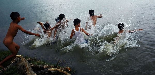 People swimming in water