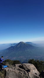 Scenic view of mountains against clear blue sky