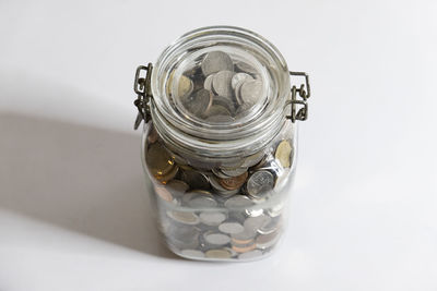 High angle view of glass jar on table