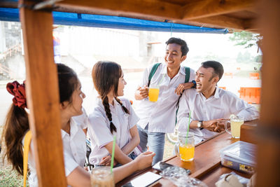 Female friends sitting at restaurant