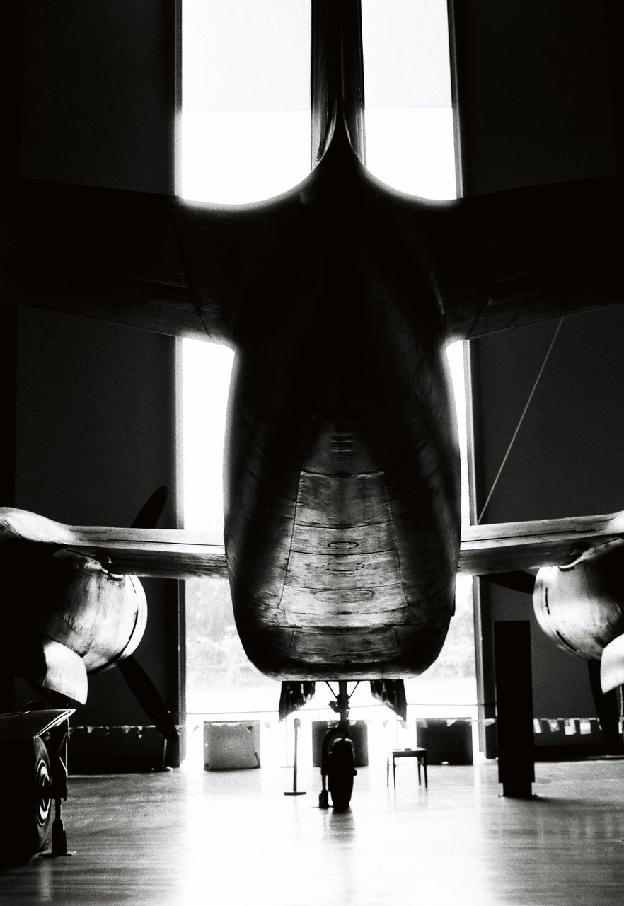 LOW ANGLE VIEW OF AIRPLANE IN AIRPORT RUNWAY