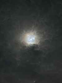 Low angle view of moon in sky at night