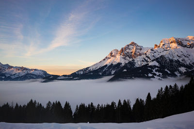 Scenic view of snowcapped mountains against sky during winter