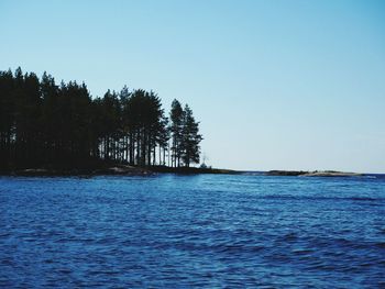 Scenic view of sea against clear blue sky