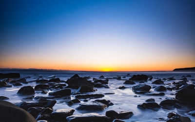 Scenic view of sea against sky during sunset