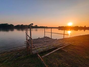 Scenic view of lake against sky during sunset