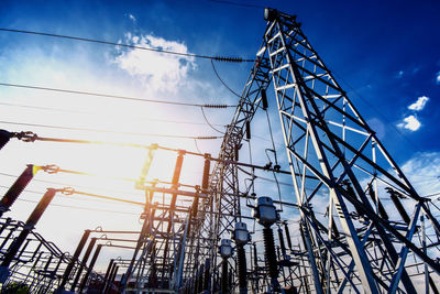 Low angle view of electricity pylon against sky