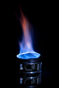 Close-up of flame on black background