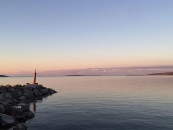Scenic view of sea against clear sky during sunset