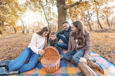 People sitting in park during autumn