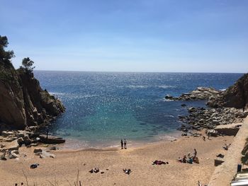 High angle view of rocks on beach against sky