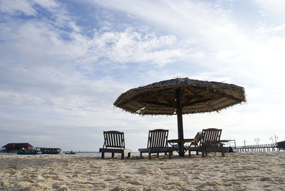 Gazebo on beach against sky